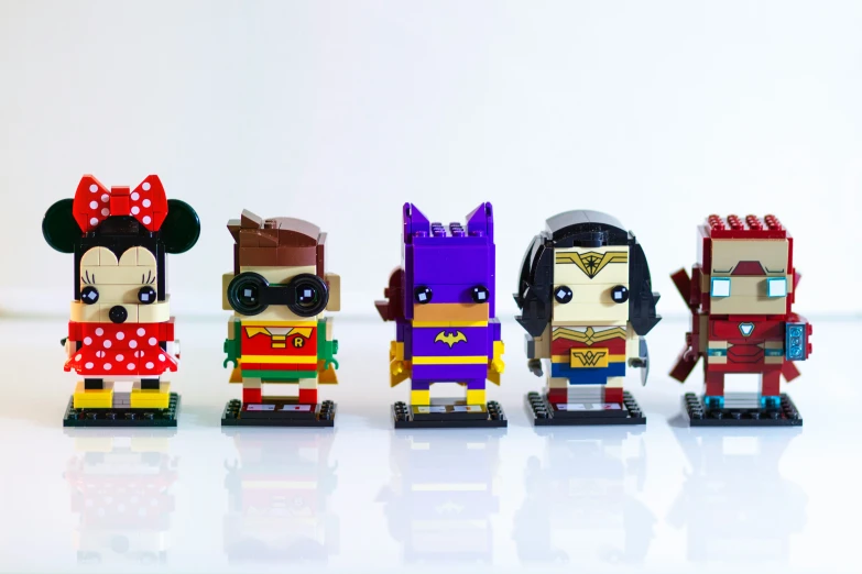 a group of lego disney characters are standing