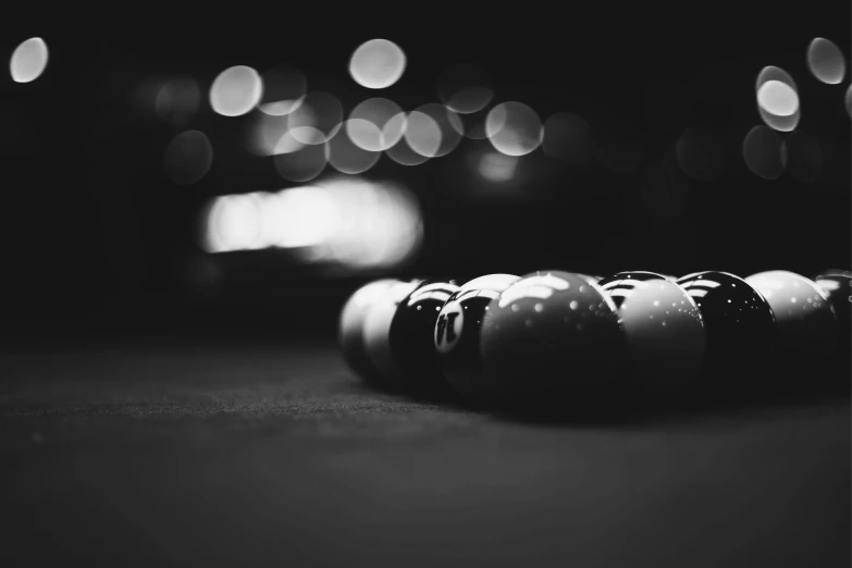 several pool balls sitting on a table in a pool