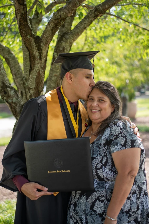 an image of a young couple kissing the camera