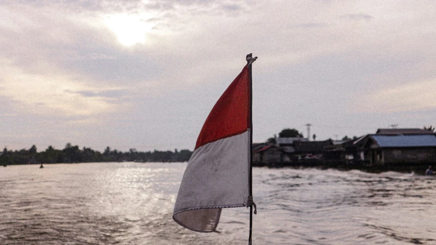 the side of a boat with a flag on it