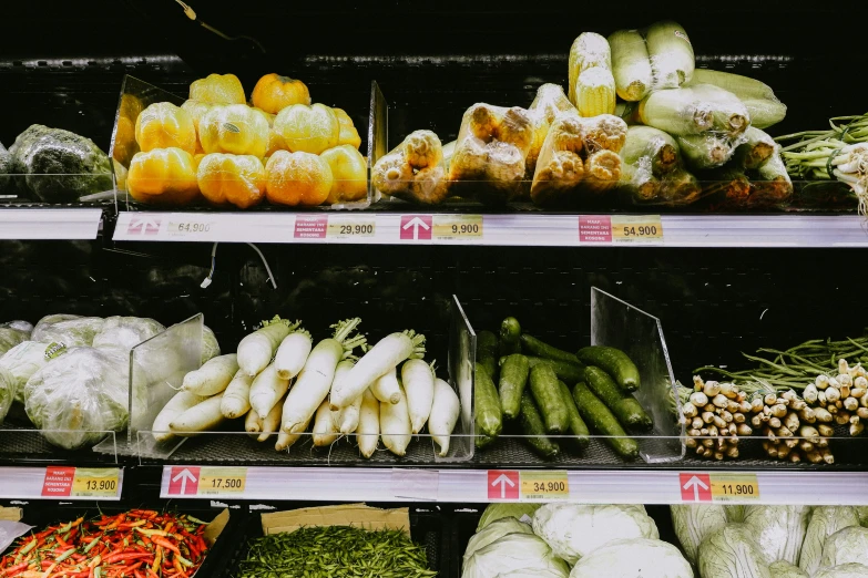 produce in display for sale with prices displayed