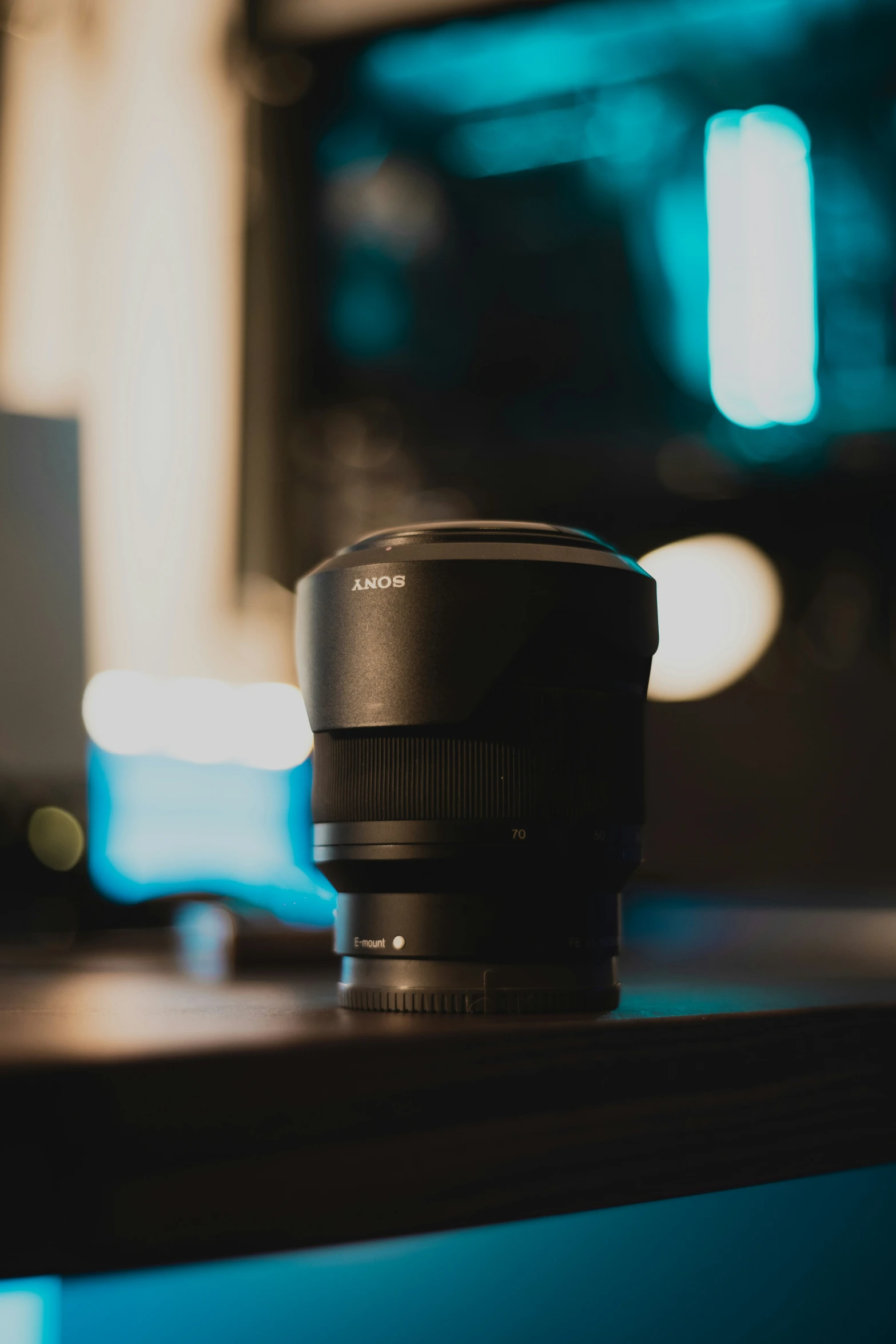 the lens is positioned on top of a desk