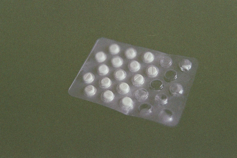 a contrapified medicine pill filled with water and white pills