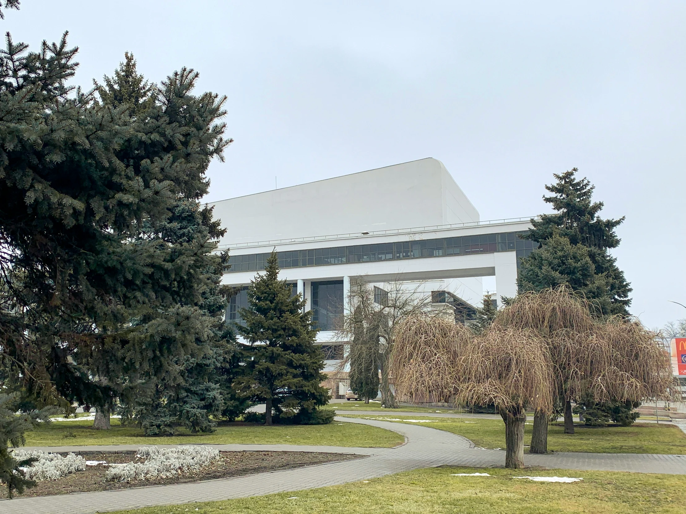 there is a building next to the trees