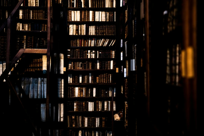 a room with bookshelves covered in rows of books