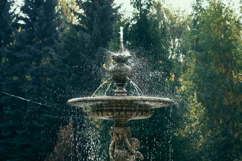 a water fountain is spouting off into the sky