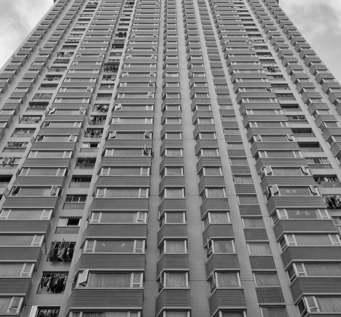 a tall building with many windows and a sky scr