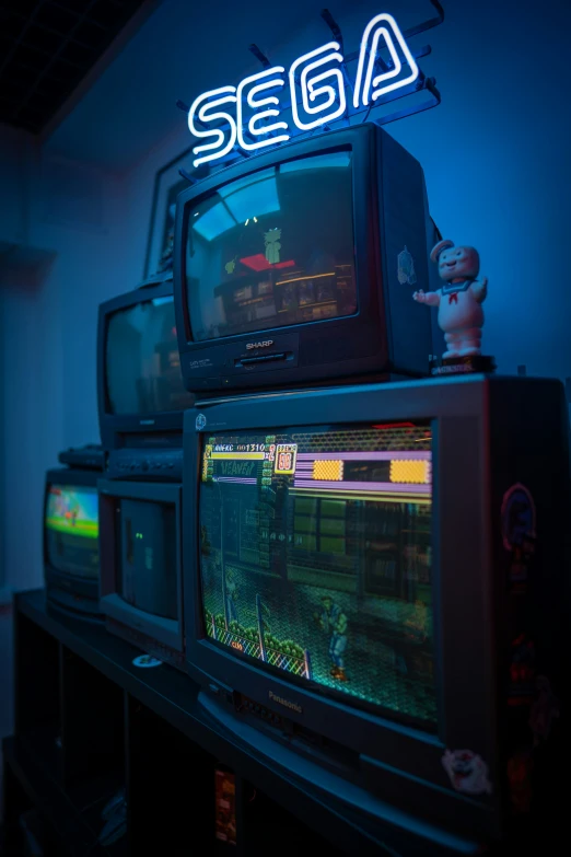 some old televisions are set on display together