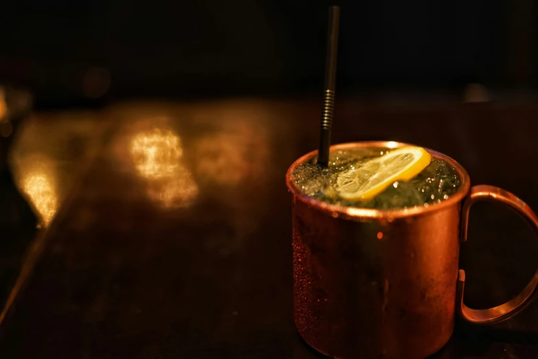 a cold drink in a copper mug on a table