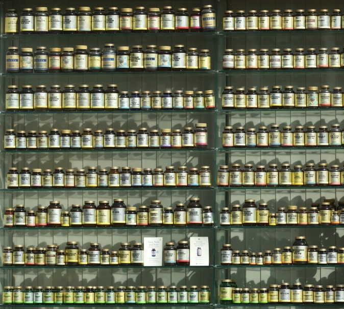 shelves holding many different jars and containers with numbers