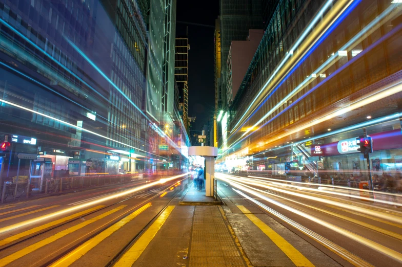 a city street filled with traffic and tall buildings