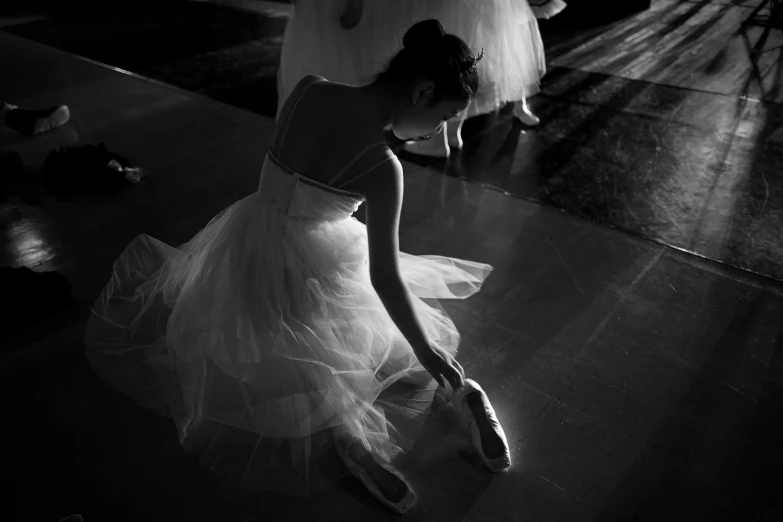 a black and white image of woman with shoes