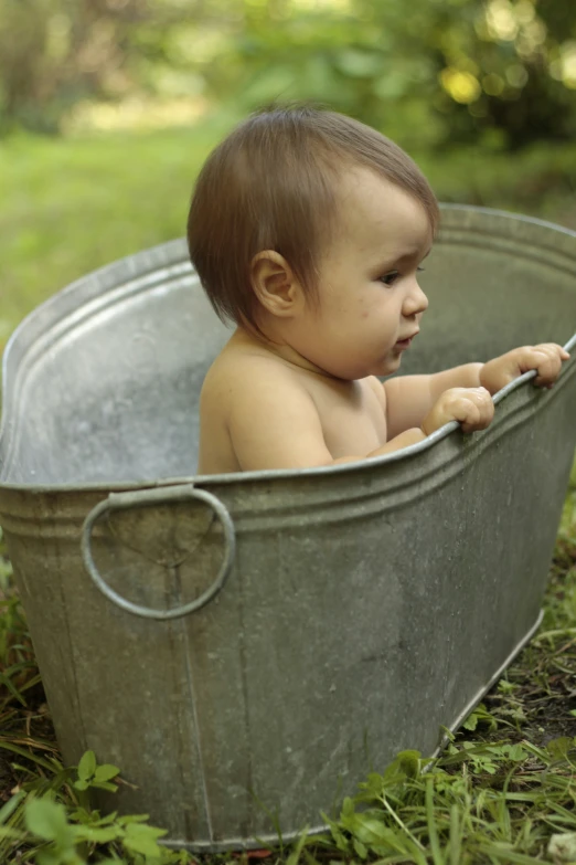 a small baby is playing in the water