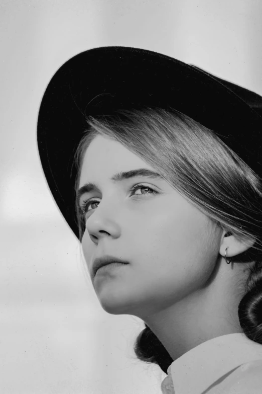 black and white pograph of young woman in hat