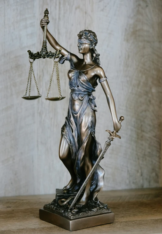 statue of lady justice holding sword and scales