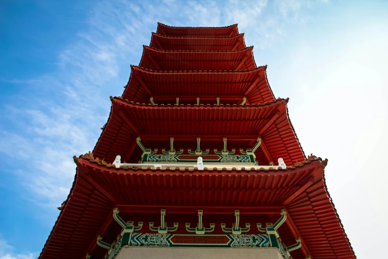 a tower is made up of red wooden material