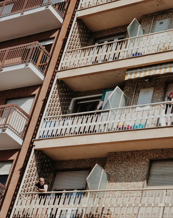 the outside of a building with balconies, window and doors