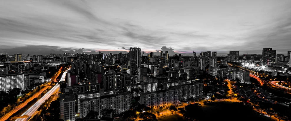 a city skyline with large buildings in the distance