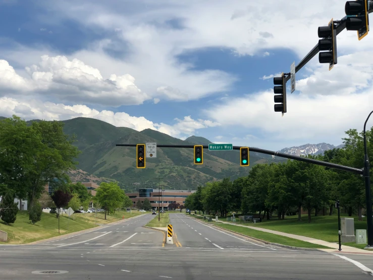 a road with an intersection and traffic lights on it