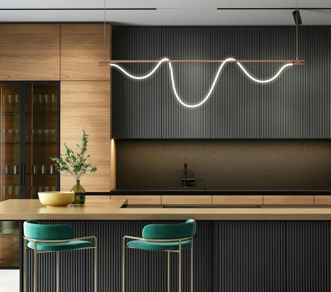 an interior kitchen with bar stools, an island and cabinets