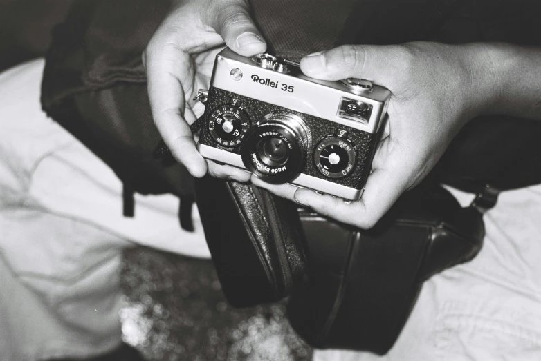 a person holding a camera in their hands