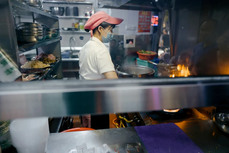 a person in a kitchen preparing food