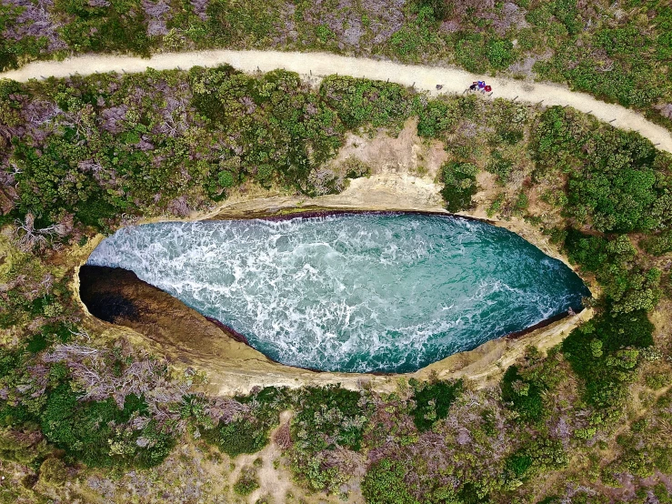 there is a large pond in the middle of the land