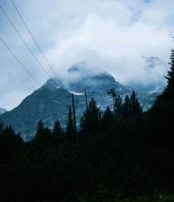 the mountains are covered in some very pretty clouds