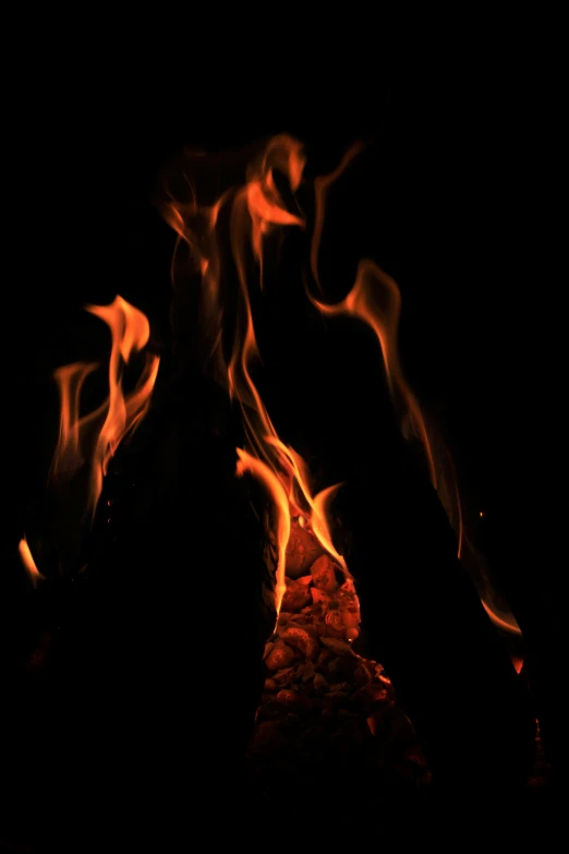 a close up of fire in the dark