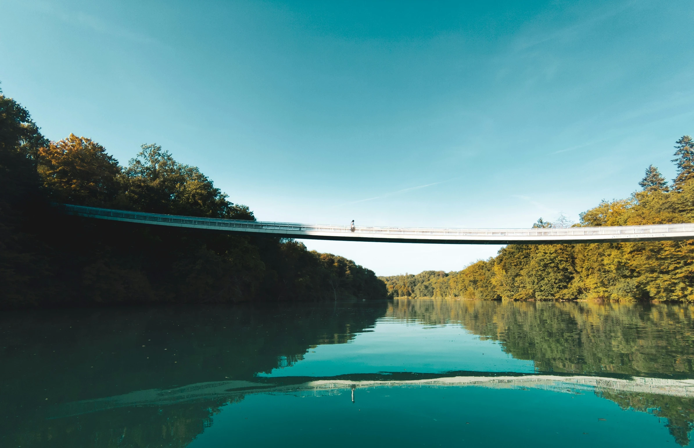 a bridge is spanning over some deep water