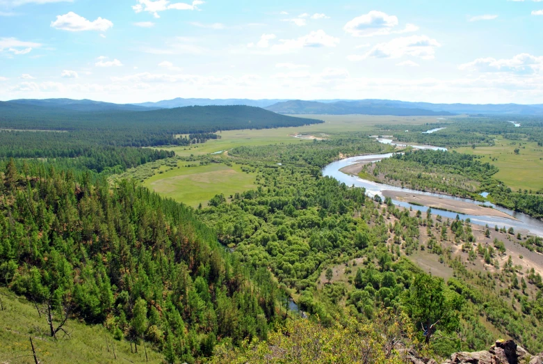 the view of a valley from a hill