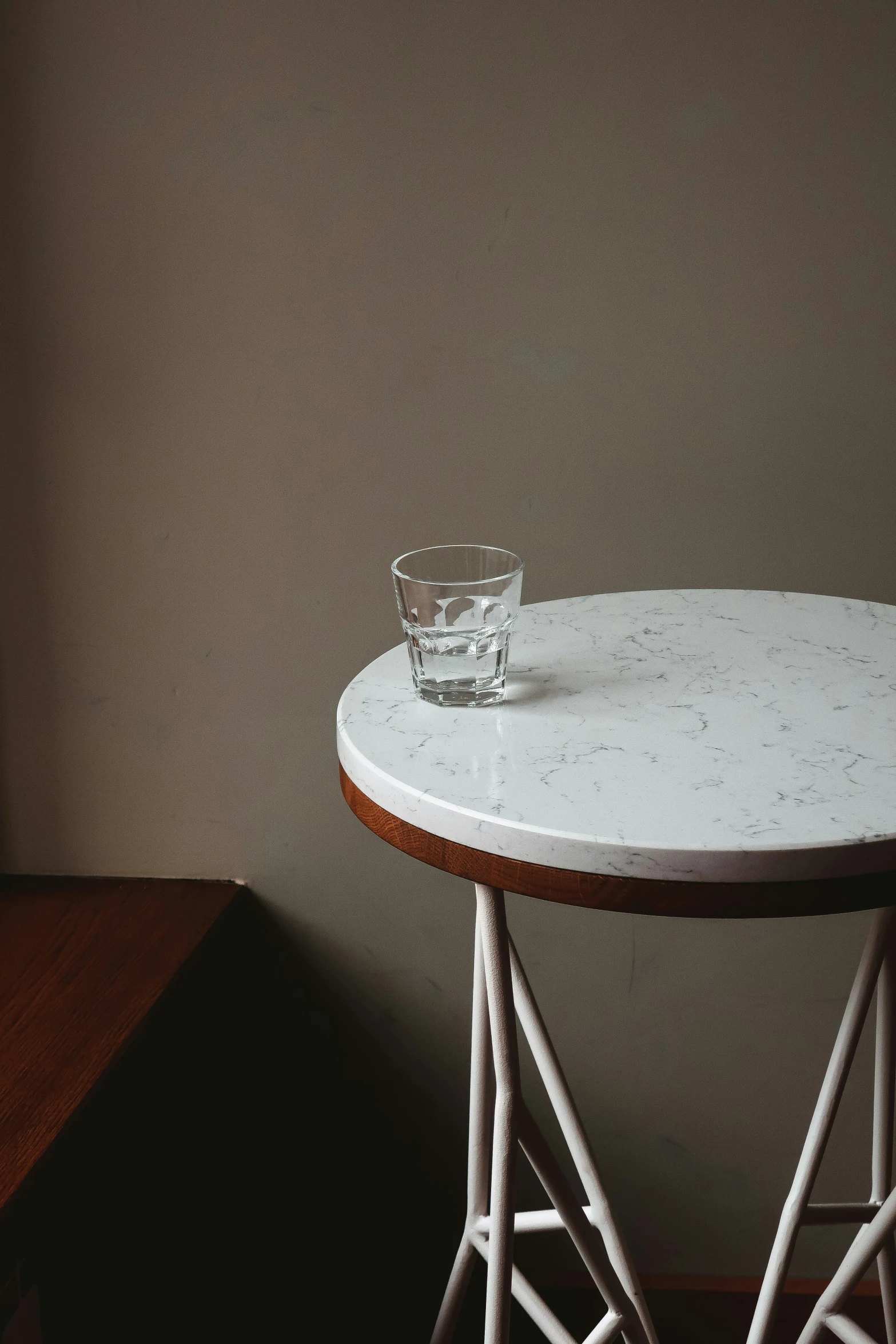 a glass and a table on a brown tablecloth