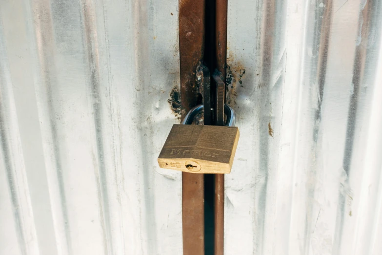 an old rusty door locked with a padlock