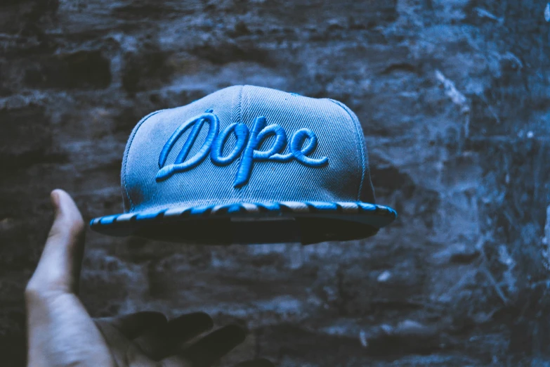 a cap with the words drop embroidered on it