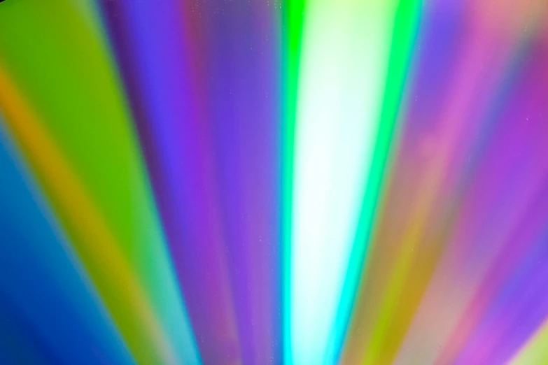 a blurry light has been colored into different colors