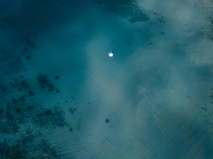 aerial view of a boat on the ocean