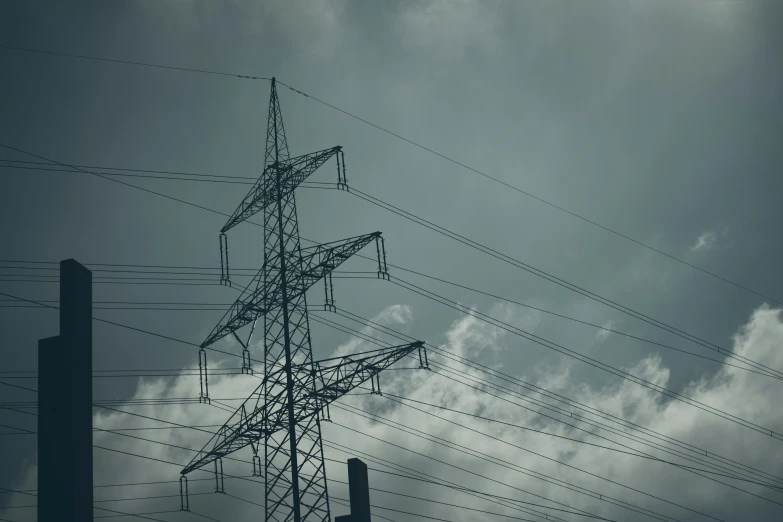 several wires are attached to the tops of two towers