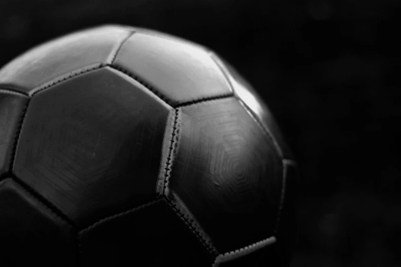 an old black and white po of a soccer ball