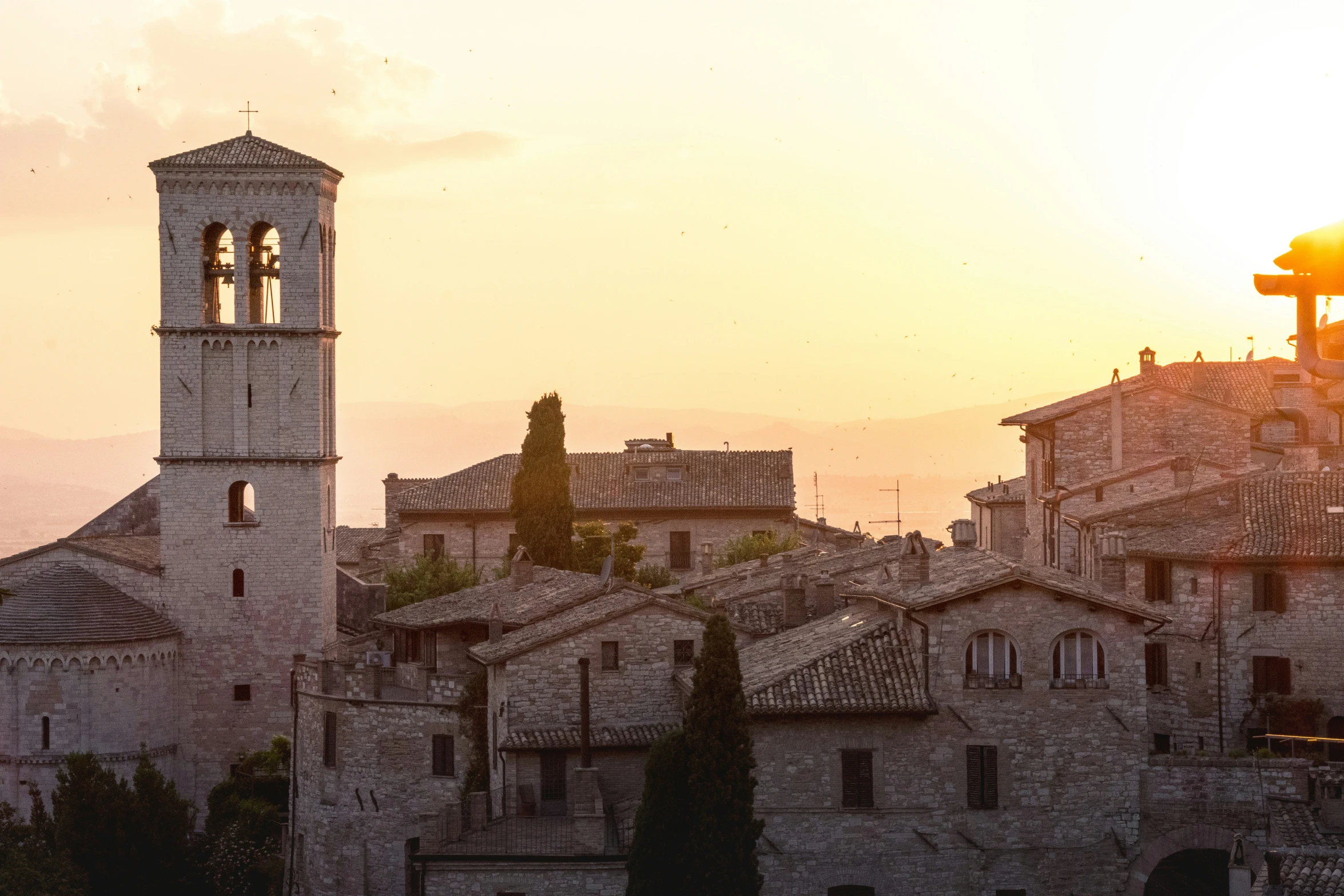 the sun shines bright above an urban area