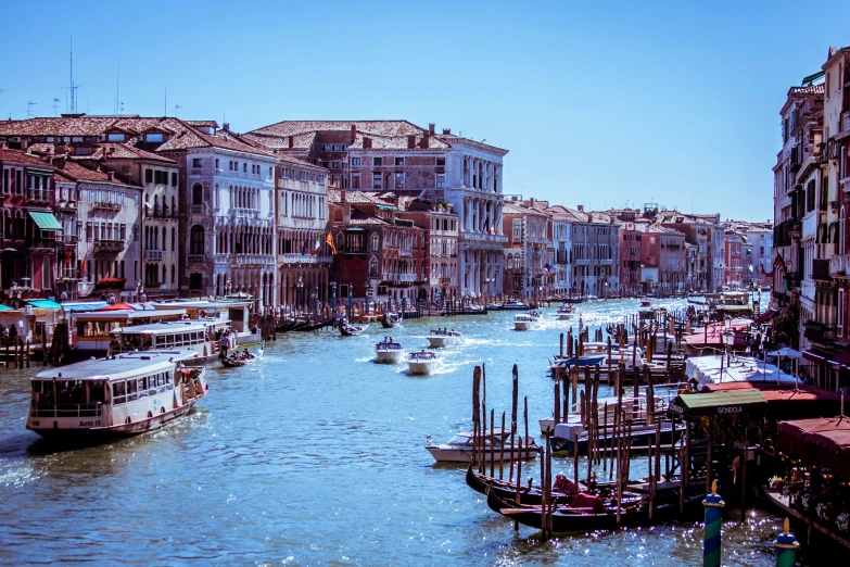 several boats and some buildings in the water