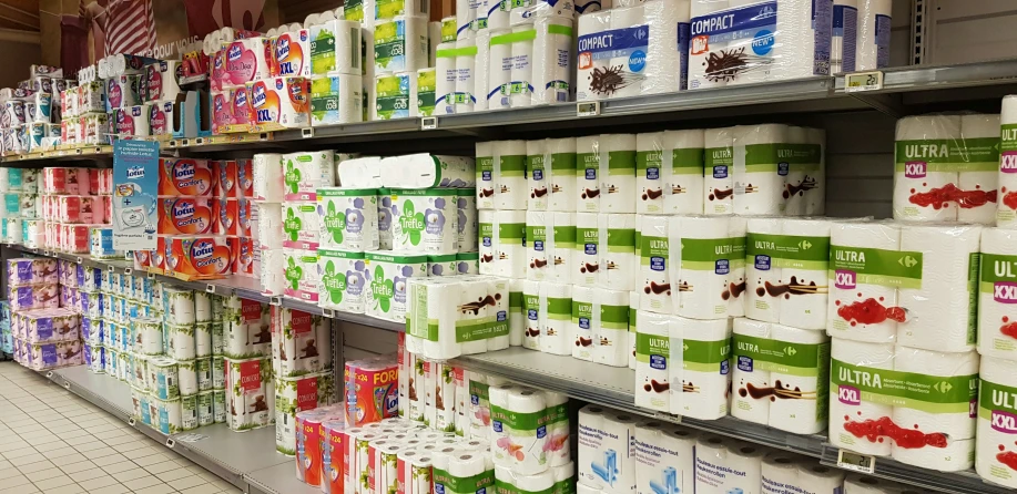 several rows of toilet paper in a store