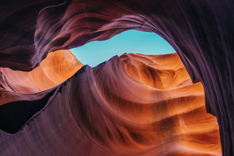 a rock formation with large wavy red rocks