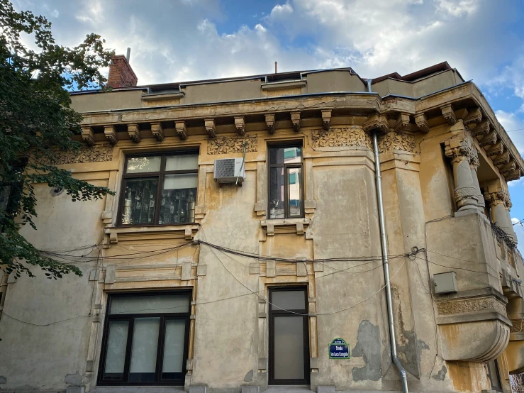 an old building with the name & symbol on it