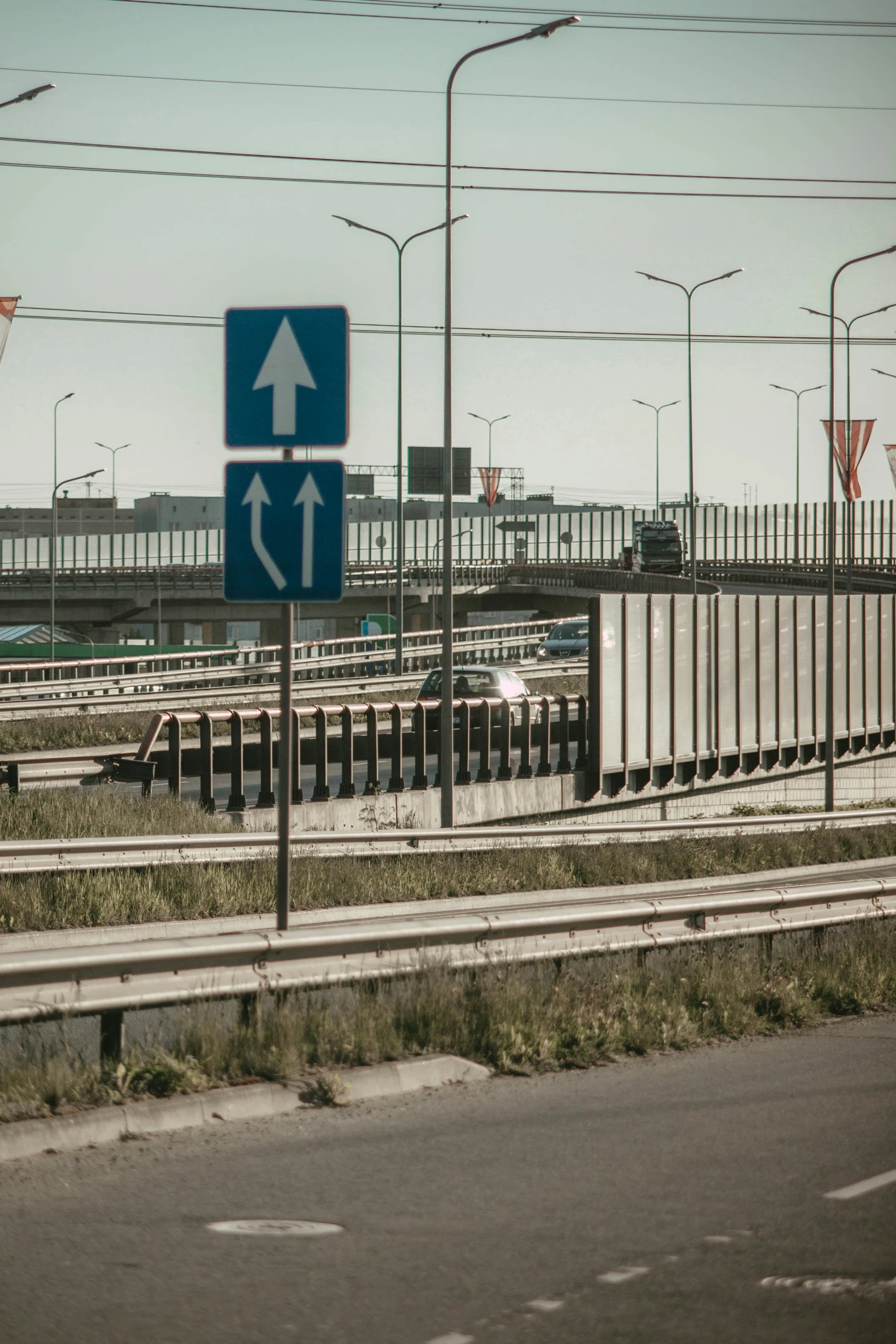 several highway signs that indicate drivers which way to go