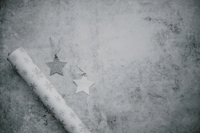 a star and some paper are left on the ground