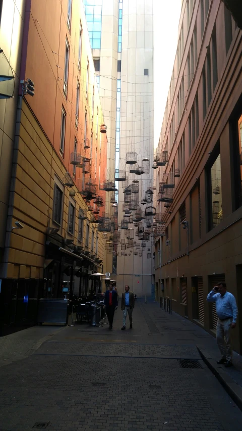 a couple of men walking down a street