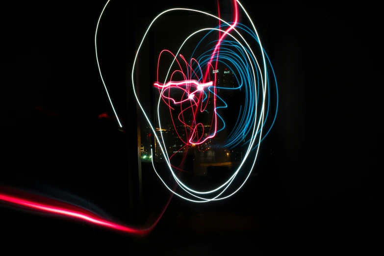 a light painting with colorful shapes is in the dark