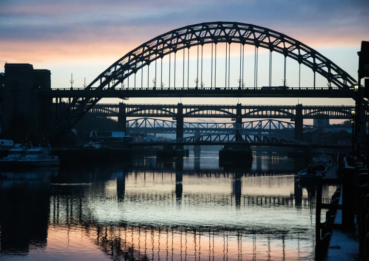 a very tall bridge over a large body of water