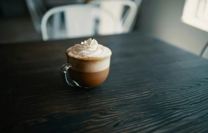 a  chocolate drink is on a dark table