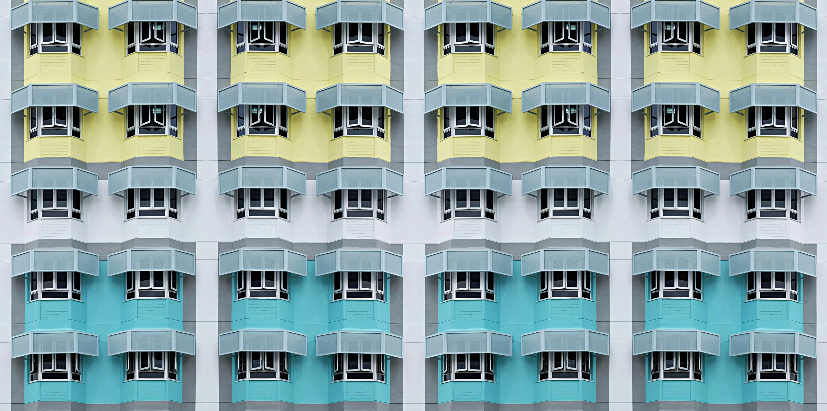 some blue yellow and white windows buildings and light